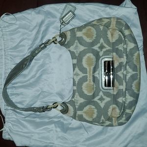 Womens coach purse. Gray with white, beige, rose accents & a soft shimmer.